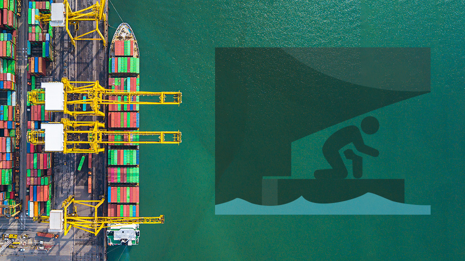 Aerial view of container ship in port with a stowaway icon superimposed