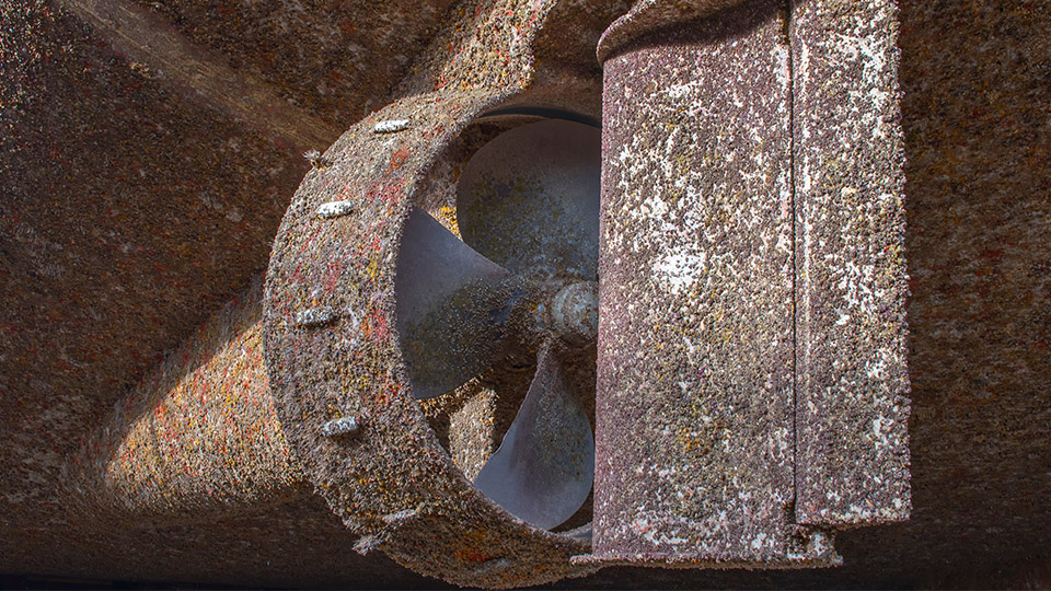 image of ship propeller covered in barnacles