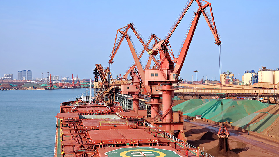 Iron ore being loaded onto a dry bulk ship