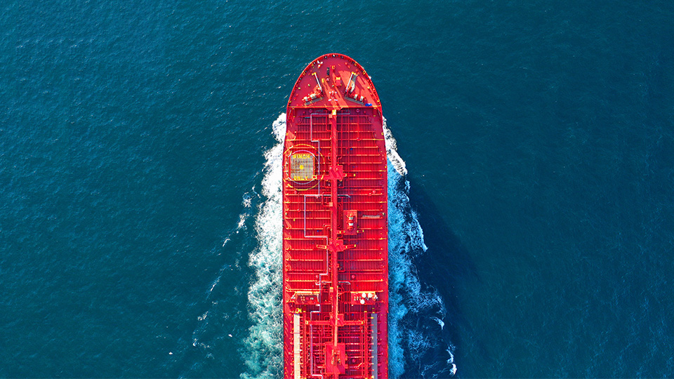 Aerial view of red tanker ship at sea