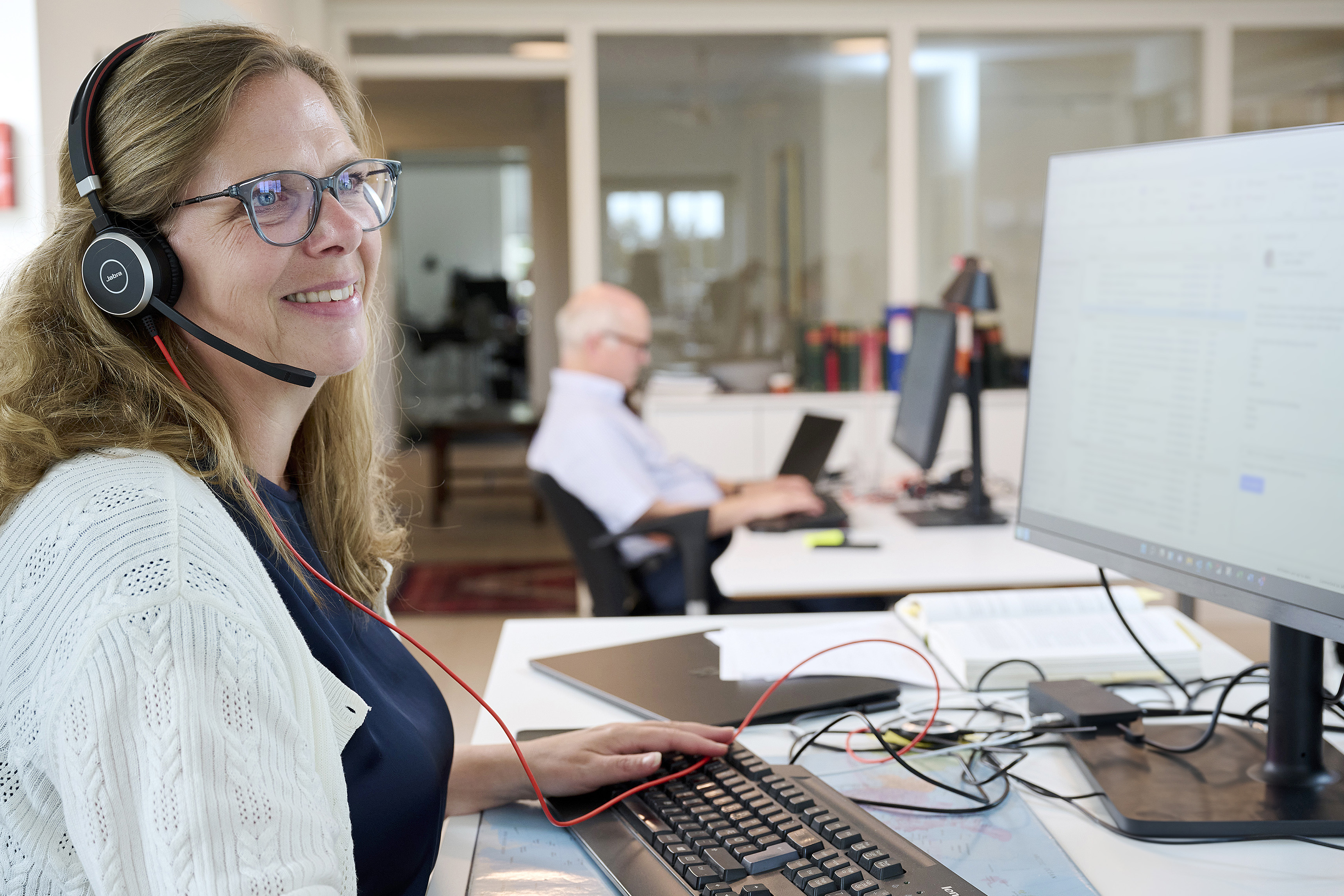 Merete L. Greisen of BIMCO using a headset in a phone call