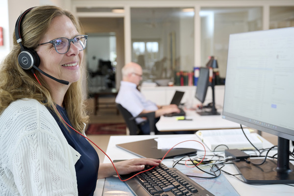 Merete L. Greisen of BIMCO using a headset in a phone call