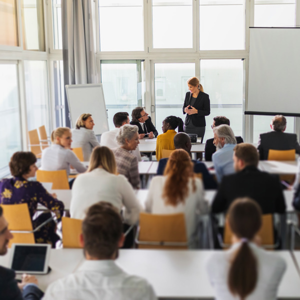 people in a classroom with an instructor at the front