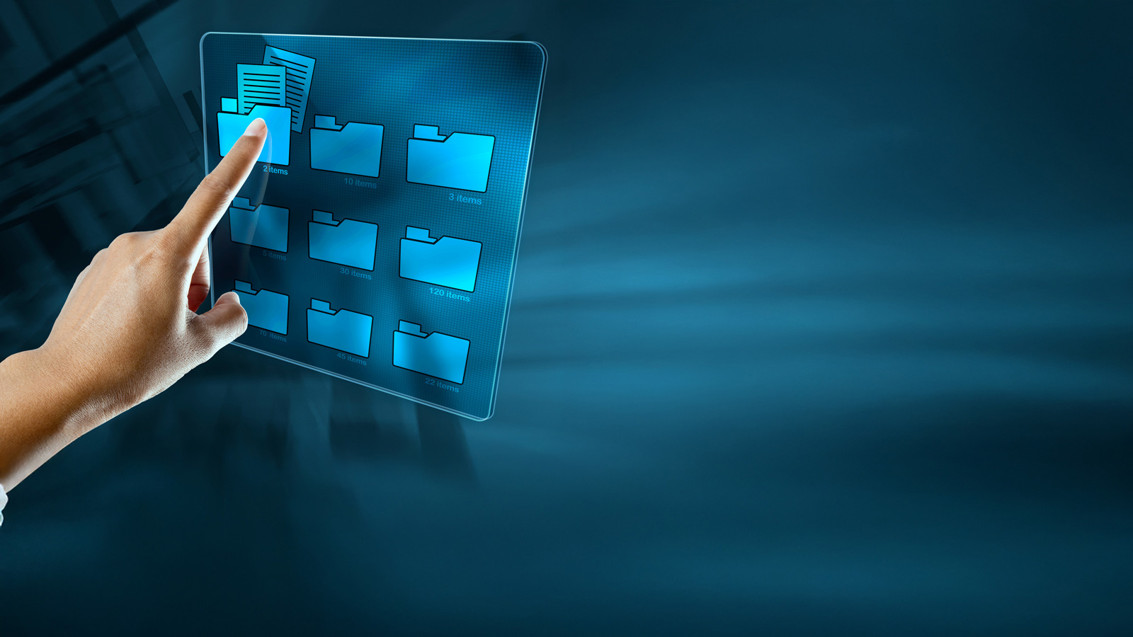 a finger pointing at a touchscreen