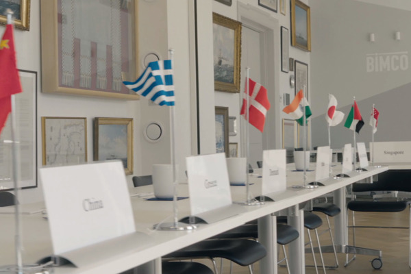 Flags and country signs on a committee table in BIMCO House