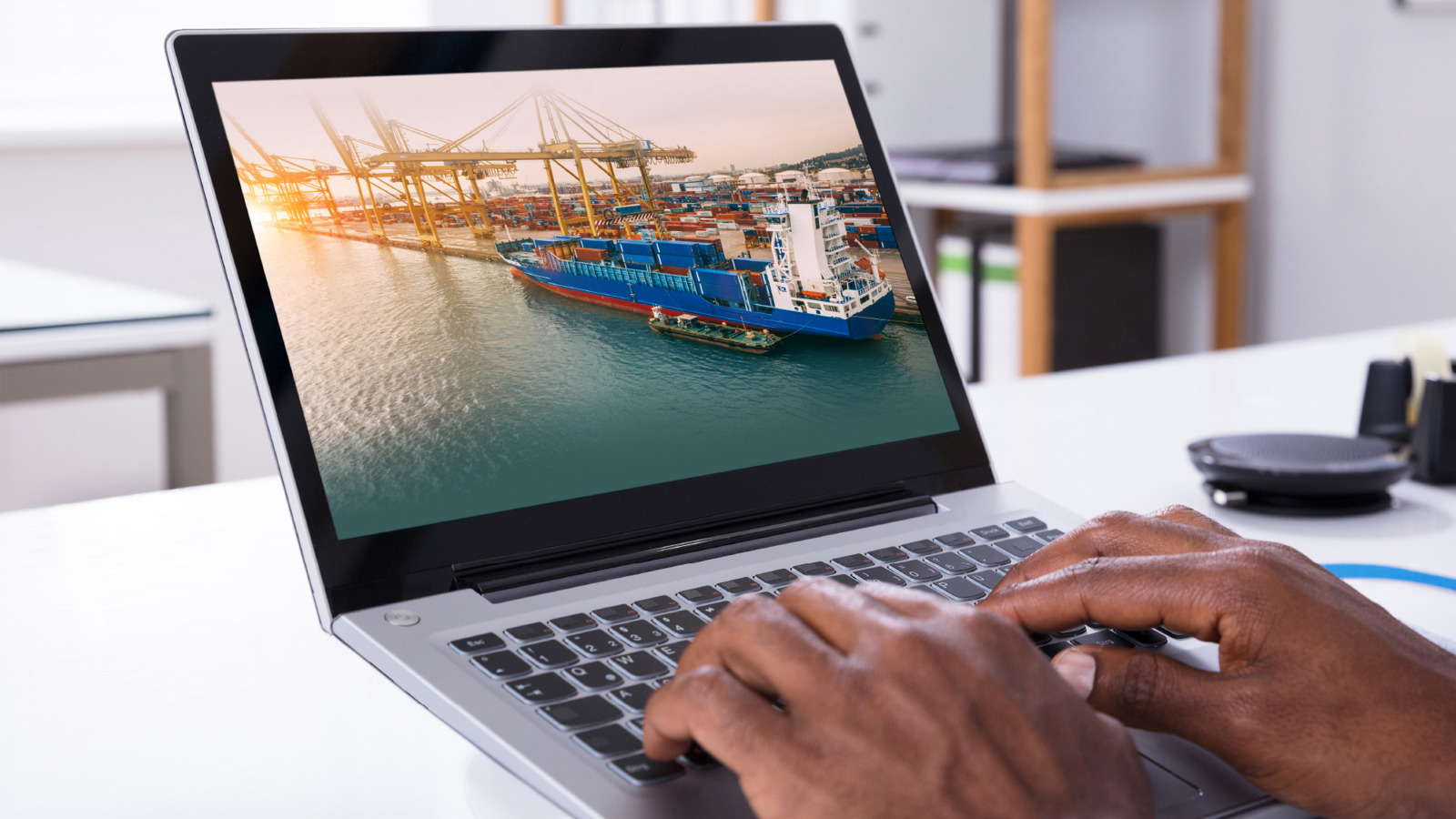 person typing on a laptop