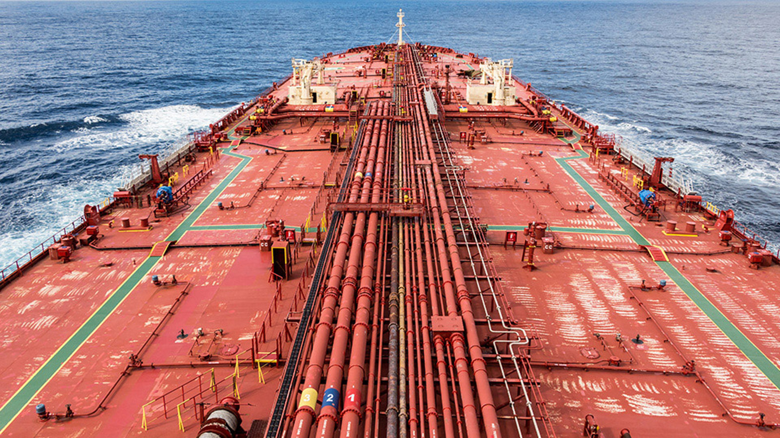 Deck of a large tank ship seen from the bridge looking forward to the bow