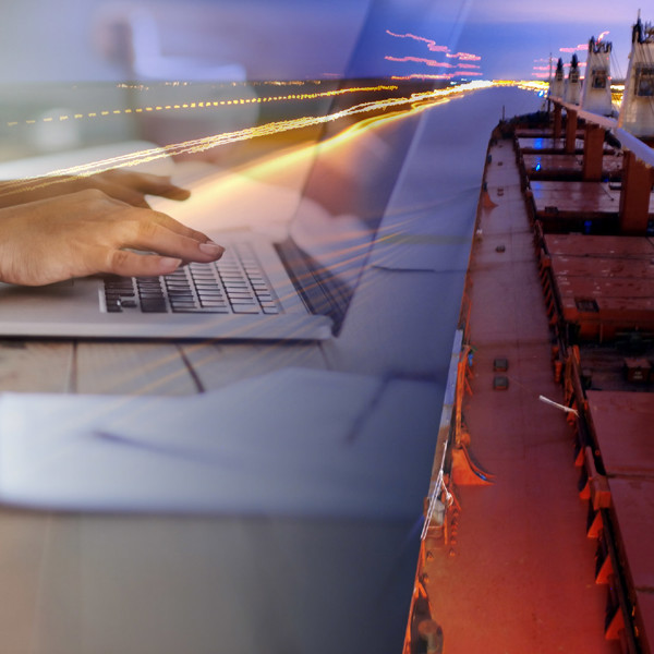 collage of hands working on a laptop on the left, red bulker ship navigating a canal on the right