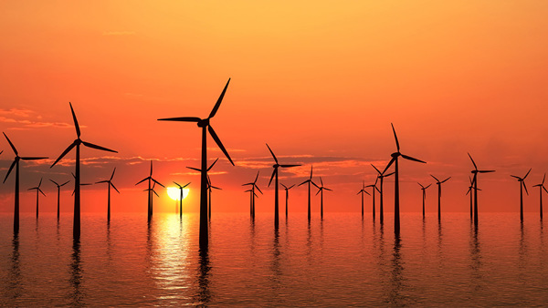 Offshore wind farm at sunrise/sunset