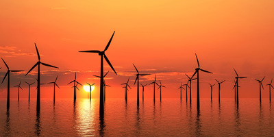Offshore wind farm at sunrise/sunset