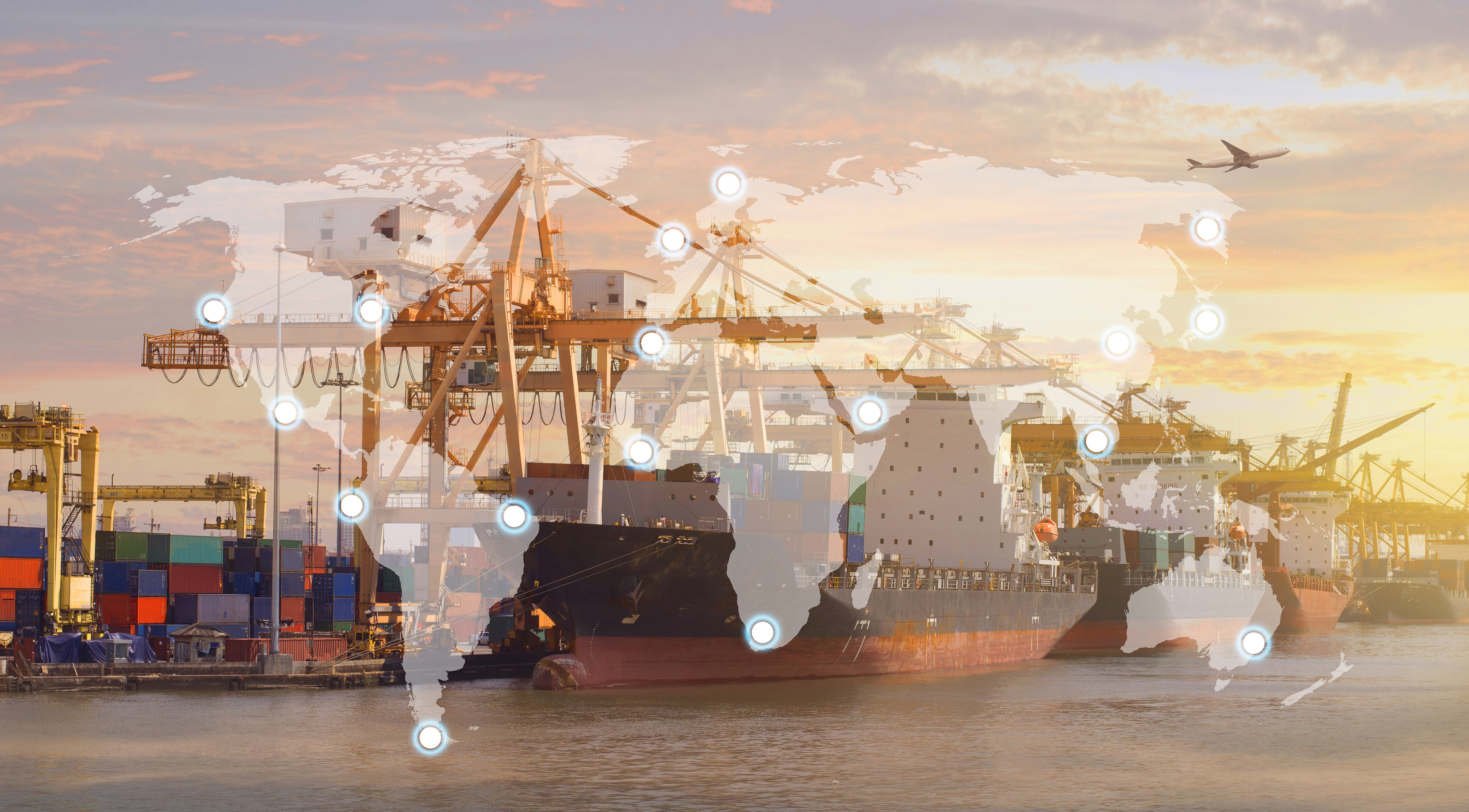 A container ship in port with a map of the world superimposed on the image